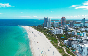 Naklejka premium Aerial view of Miami Beach with turquoise waters. Drone shot of Miami skyline. Top view of South Miami Beach. Miami cityscape with luxury skyscrapers and ocean. View of Miamis famous coastline.