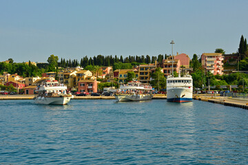 Boats moored at the port of Corfu Old Town, Greece. The port is used both by ferries travelling to Albania, Italy and other parts of Greece, and by touristic day trip boats