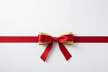 a close up of a red ribbon with a gold bow