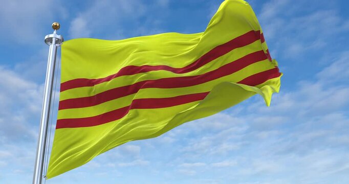South Vietnam flag with flagpole waving in wind, rolling clouds background looping, 4K video (Perfect Loop)
