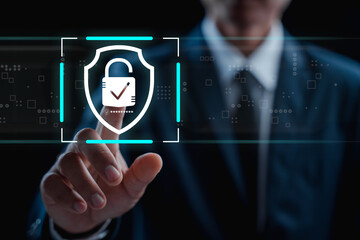 Businessman touching on virtual screen key lock for secure access, featuring a prominent digital lock icon and cyber security interface. Showcases modern technology for access authentication