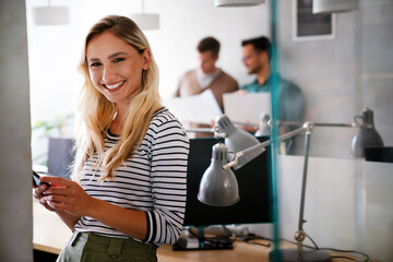 Portrait of successful businesswoman in creative office. Beautiful startup freelancer business woman