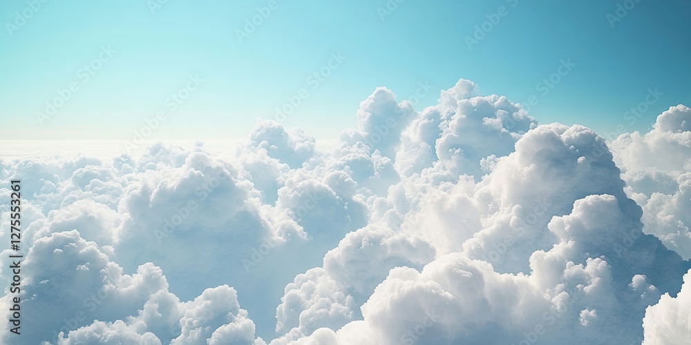Poster soft fluffy white clouds fill the frame against a bright clear blue sky creating a serene and uplift
