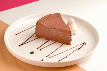 Chocolate cheese cake served with cream.