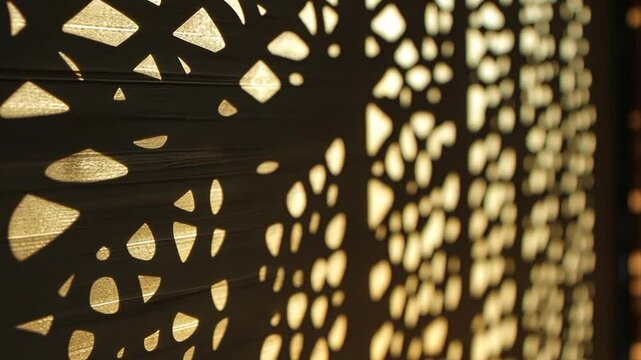 Abstract light and shadow pattern through a perforated screen.