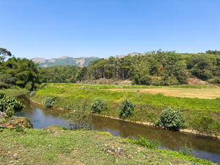 Obraz premium Scenic view of the landscape around the triveni sangama, Bhagamandala, Karnataka.