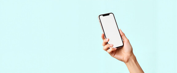 Modern smartphone held in hand against a light backdrop, minimalism