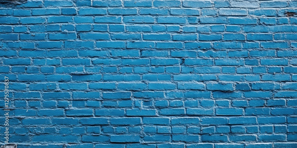 Poster Blue textured brick wall with a uniform azure color, showcasing detailed surface imperfections and a horizontal layout, ideal for backgrounds or textures.