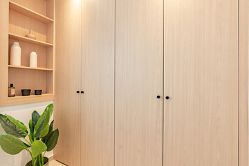 a close up image of newly fitted illuminated wardrobes and shelving in bedroom renovation 
