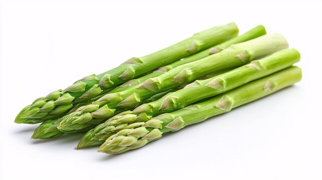 Fresh green asparagus spears arranged on white background