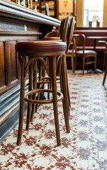 Close-Up of a Stylish Bar Stool Against a Vibrant White and Red Mosaic Background