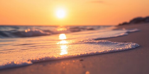 Tranquil beach scene at sunset with gentle waves caressing golden sand and a warm purple horizon reflecting serene summer vibes.