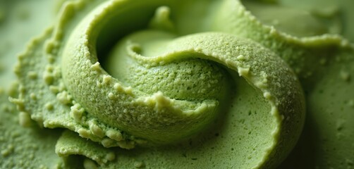 Matcha ice-cream background texture. Green tea dessert with creamy swirl surface. Macro photo of milk ice with green tea flavor and refreshing Japanese powder flavor.