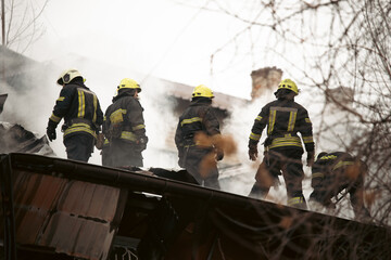 Firefighters confront raging flames amid dense smoke in a high-stakes rescue operation. Perfect for...