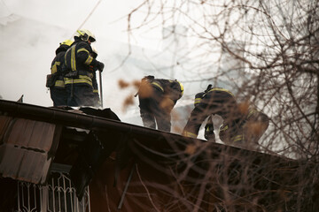 Firefighters confront raging flames amid dense smoke in a high-stakes rescue operation. Perfect for...