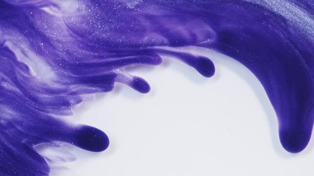 A closeup of purple and white abstract liquid flowing on the surface, creating an artistic background with space for copy. Fluid art backdrop for your design project.
