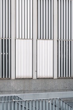 Modern office building with clean geometric grid, highlighting urban design aesthetics.