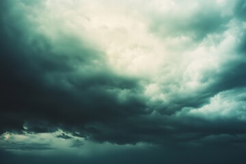 Obraz premium Ominous storm clouds gather, casting a foreboding ambiance over the landscape, hinting at impending weather turmoil.