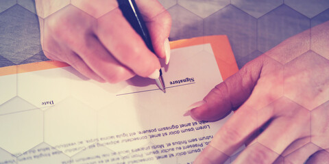 Hand of businesswoman signing a document, geometric pattern