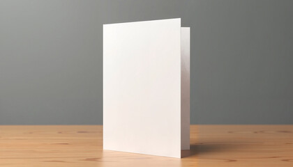 This vertical greeting card mockup features a folded design on a wooden surface. The modern and minimalist presentation is ideal for showcasing invitations, greeting cards, or announcements