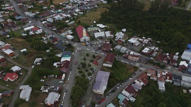 Aerial view of Chonchi, a charming town in the Los Lagos Region of Chile, showcasing its unique architecture and serene atmosphere. orbit motion