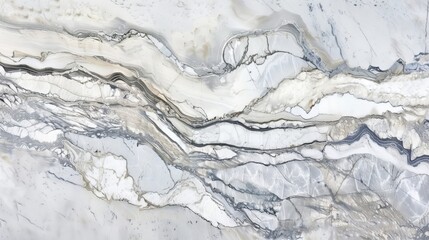 A close-up view of a polished marble surface reveals stunning gray and white patterns formed by natural veins. The smooth texture emphasizes the elegant design of the stone