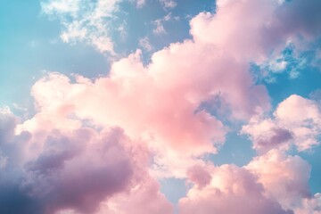Obraz premium Gentle pink and blue clouds conjure a dreamy sky, evoking feelings of calm and endless possibilities.