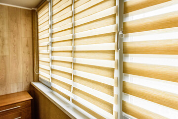 Window roller, duo system day and night in home interior. Beige blinds.