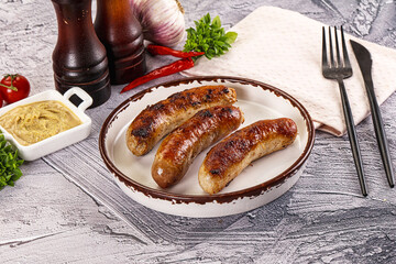 Delicous natural roasted sausages in the plate