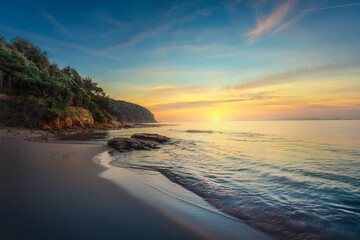 Cala Violina beach in Maremma at sunset, Tuscany. Mediterranean sea. Italy.