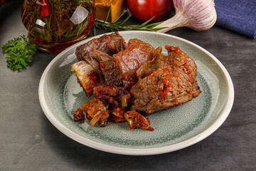 Baked beef ribs with vegetables