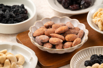 Flavored mixed nuts in bowls.