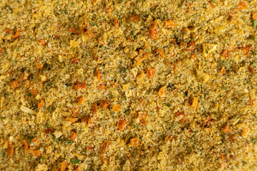 Natural seasoning with flavor enhancer, dried vegetables and salt
