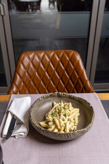 Gnocchi with steak and truffles on a plate in a restaurant
