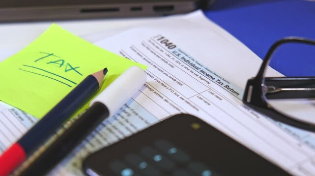 Accountant preparing tax form 1040 for tax season 2025