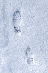 human footprints of an adult person in snow