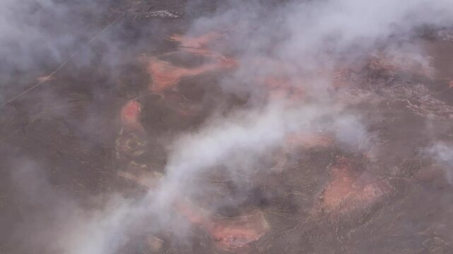 France - Reunion Island - Piton de la Fournaise - red lava on plaine des sables with clouds