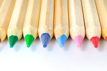 Colorful pencils arranged in a vibrant row