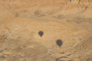 Landscape on West bank of Luxor with shadow hot air balloons, Egypt