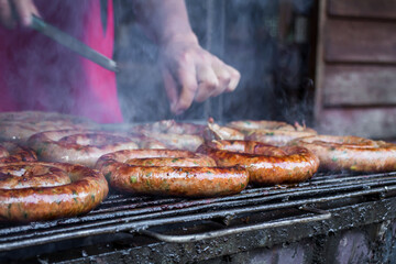 Grilled Sai Aua, Northern Thai Spicy Sausage on a barbecue grill
