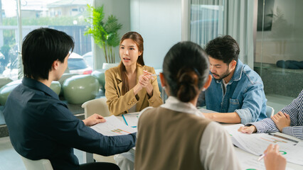 Business meeting with diverse professionals discussing strategies and ideas. atmosphere is collaborative and focused, showcasing teamwork and communication. Leader Teamwork stratup