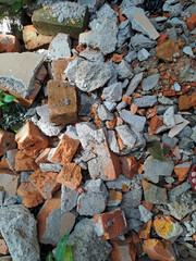 Pile of broken red bricks and fragments of concrete from destroyed building	
