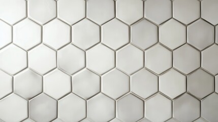 Naklejka premium A close-up view of a textured honeycomb tile pattern in soft white tones, creating an elegant and modern backdrop for interior design.