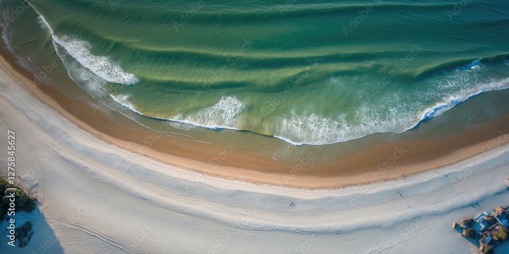 Poster aerial perspective of serene beach with gentle waves and open space for text or branding