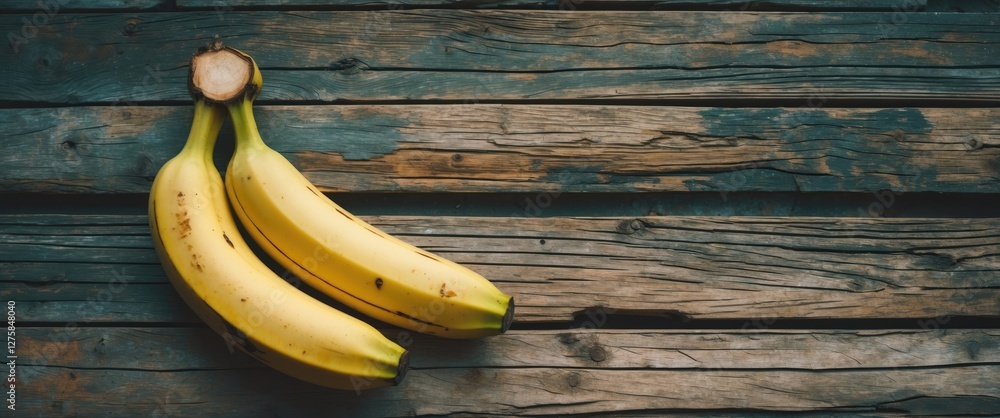 Poster bananas on rustic wooden background with ample copy space for text and design elements showcasing fr