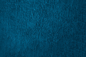Cracked blue textured surface, abstract background. many Cracks white beige paint texture on a wall. historical pattern of old retro aged past Picture surface detail.