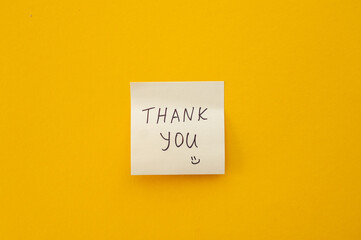 A sticky note with the word Thank you. Motivational words for personal growth, inspiring...