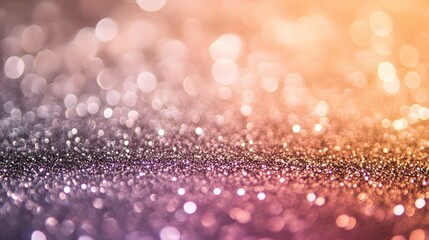 An artistic close-up of shimmering bokeh lights in gradient hues from golden orange to soft purple, creating a dreamy and festive atmosphere.