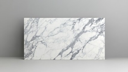 A sleek, white marble slab featuring elegant gray veining against a soft gray background, ideal for interior design and home decor.