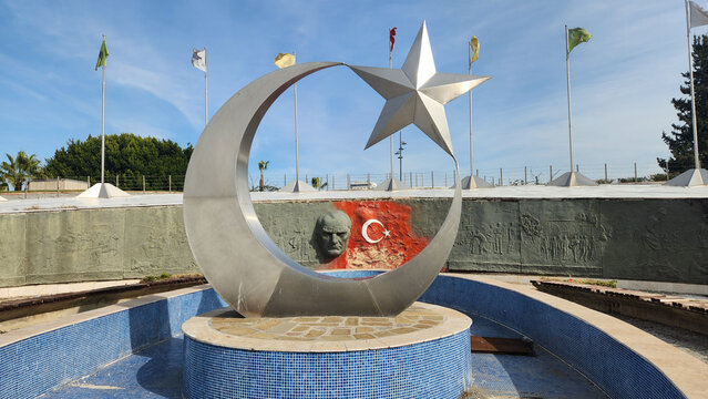 An artwork representing Mustafa Kemal Ataturk, the founder of the Republic of Turkey, and the Turkish Flag in Arif Nihat Asya Flag Park